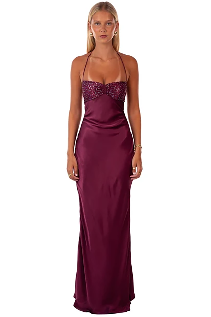 A floor-length, deep berry-colored Jade Maxi Dress in Berry featuring a sequined bodice, sleeveless silhouette, and thin halter straps.