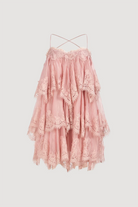 Aje Ophelia Lace Mini Dress in fawn pink, featuring a sleeveless tiered silhouette with lace trim and cross-back spaghetti straps.