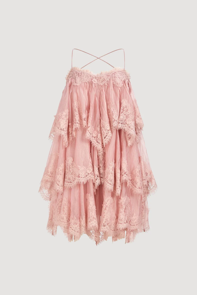 Aje Ophelia Lace Mini Dress in fawn pink, featuring a sleeveless tiered silhouette with lace trim and cross-back spaghetti straps.