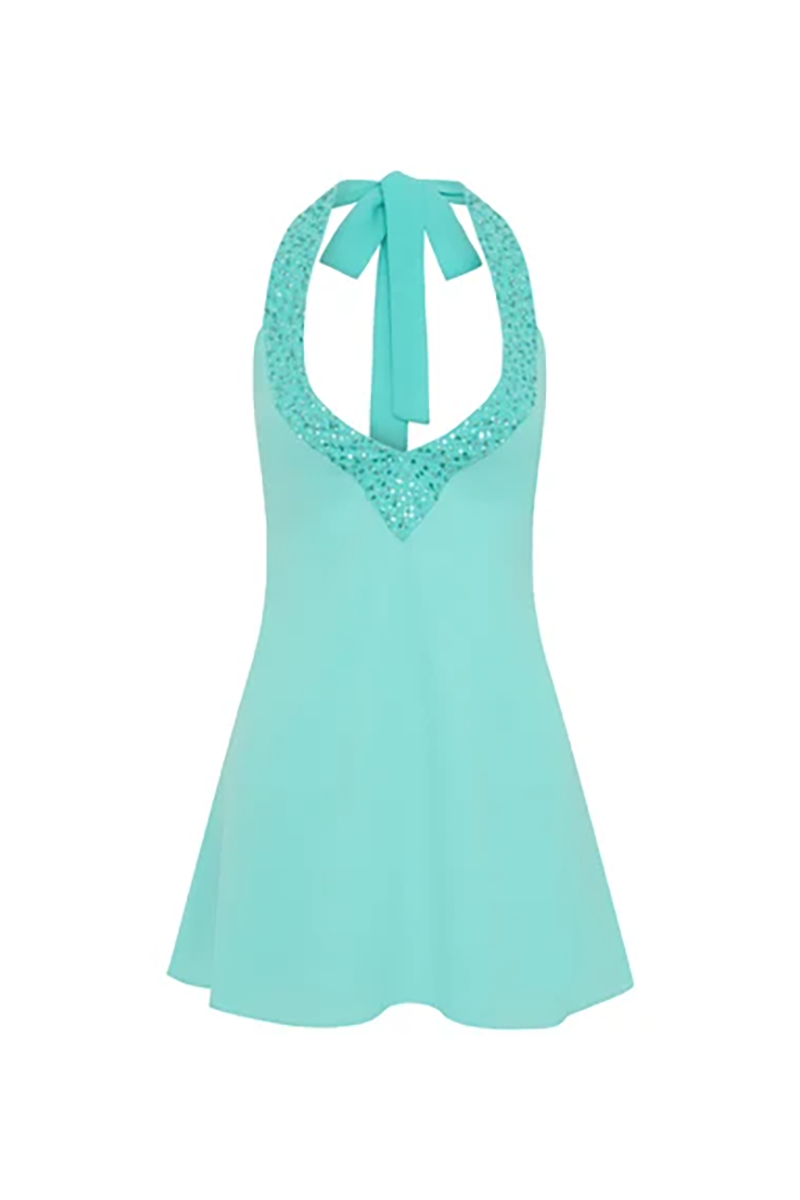 The I Am Delilah Violetta Mini Dress is a turquoise mini dress with a halter neckline featuring crystal embellishments and a tie at the back of the neck.